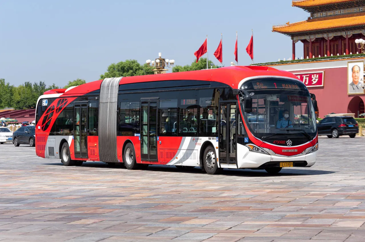 Retro Dang Dang sightseeing bus passing Tiananmen Square in Beijing