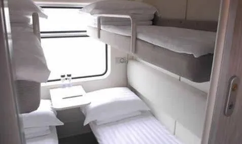 Private soft sleeper cabin with four beds on a Chinese overnight train