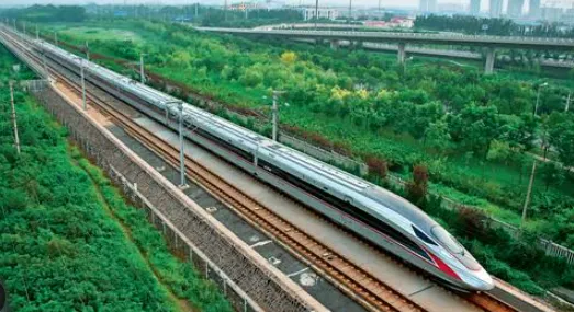 China High-Speed Rail Fuxing bullet train traveling through the countryside