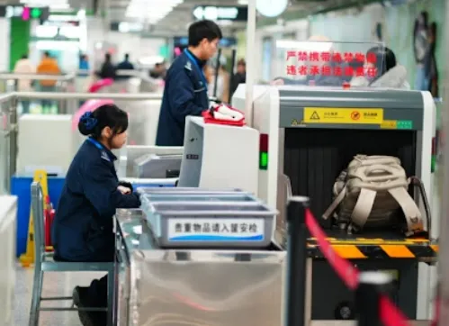 Mandatory luggage X-ray security check at Chengdu Metro subway station