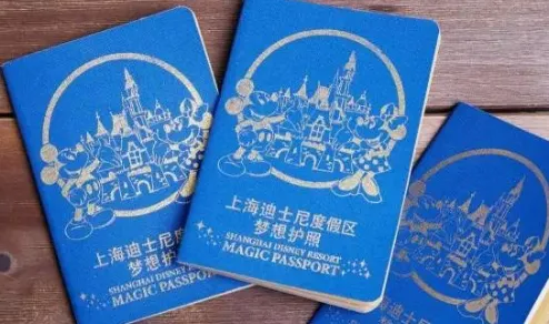 Foreign tourist scanning passport at Shanghai Disneyland entry turnstile