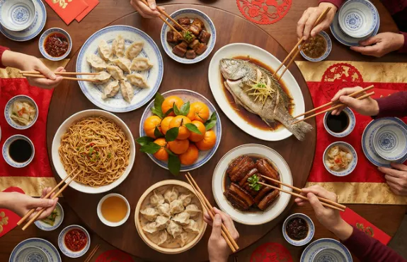 Foreign tourists enjoying an authentic meal at a local Chinese restaurant