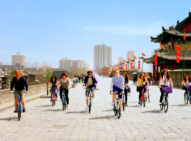 Tourists riding bicycles on the ancient Ming Dynasty City Wall in Xi'an