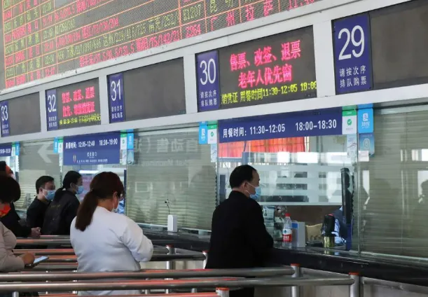 Foreigner getting 12306 passport verification at a physical China train station ticket window